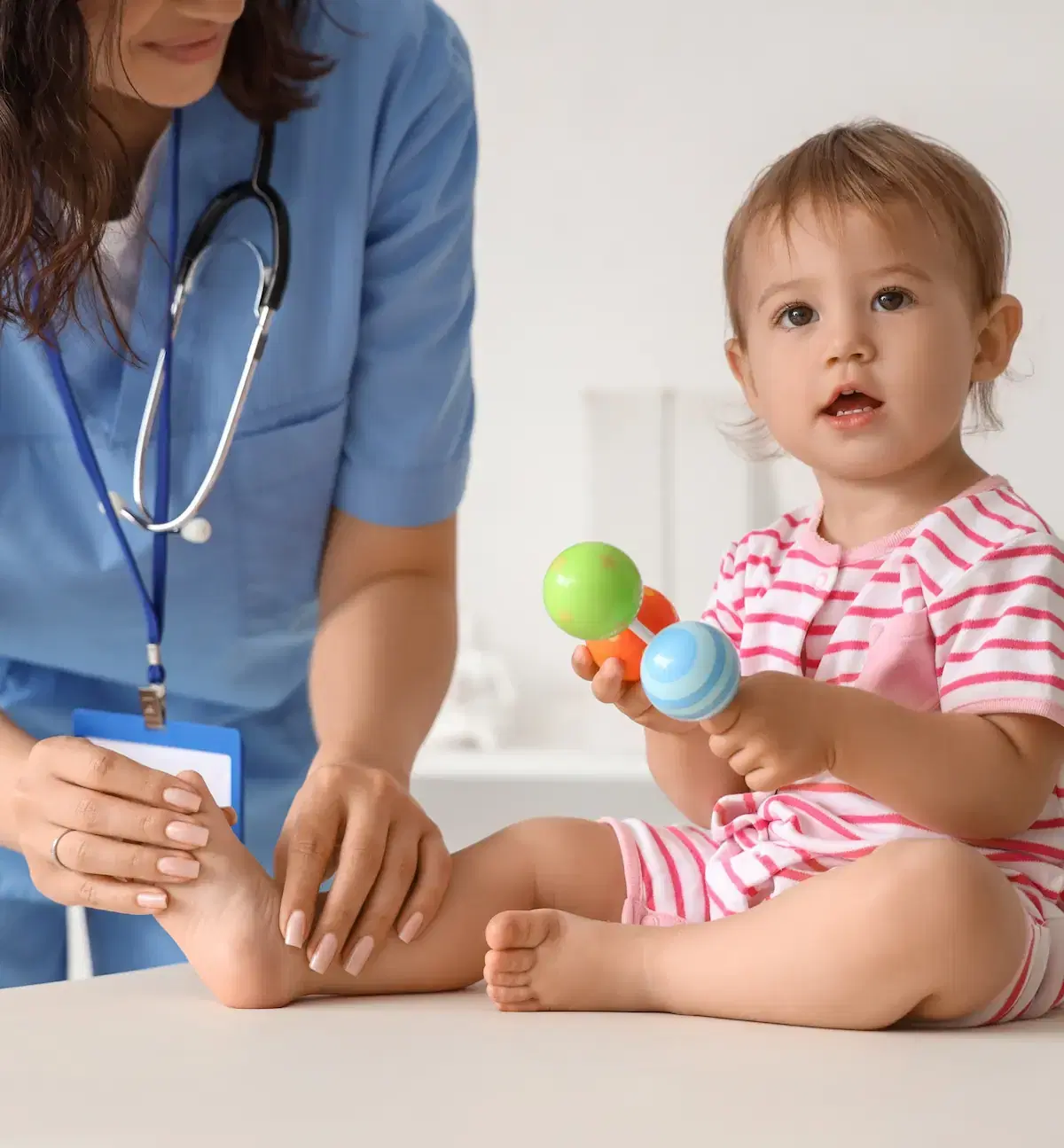 Pediatrician with infant patient