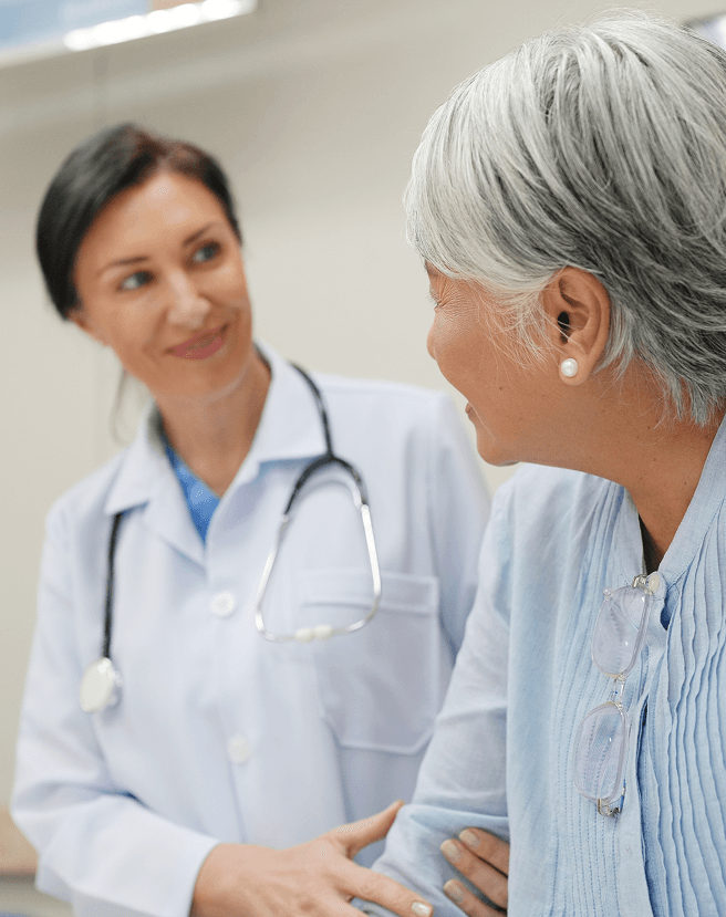 Healthcare professional speaking with a patient