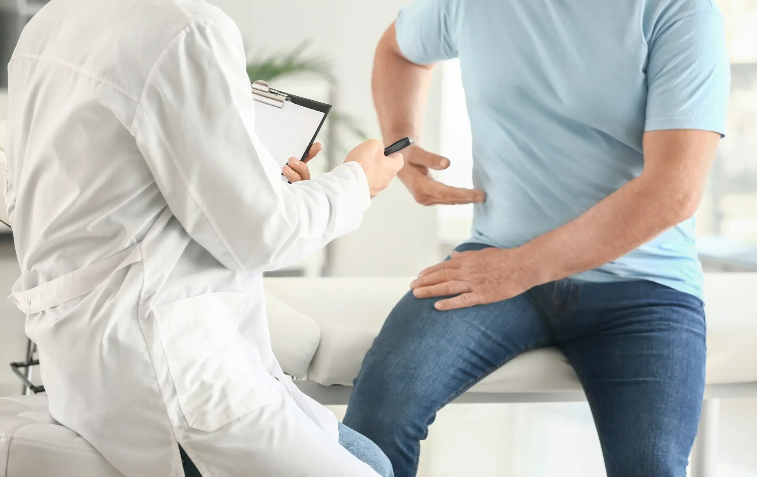 Patient talking to doctor about location of pain