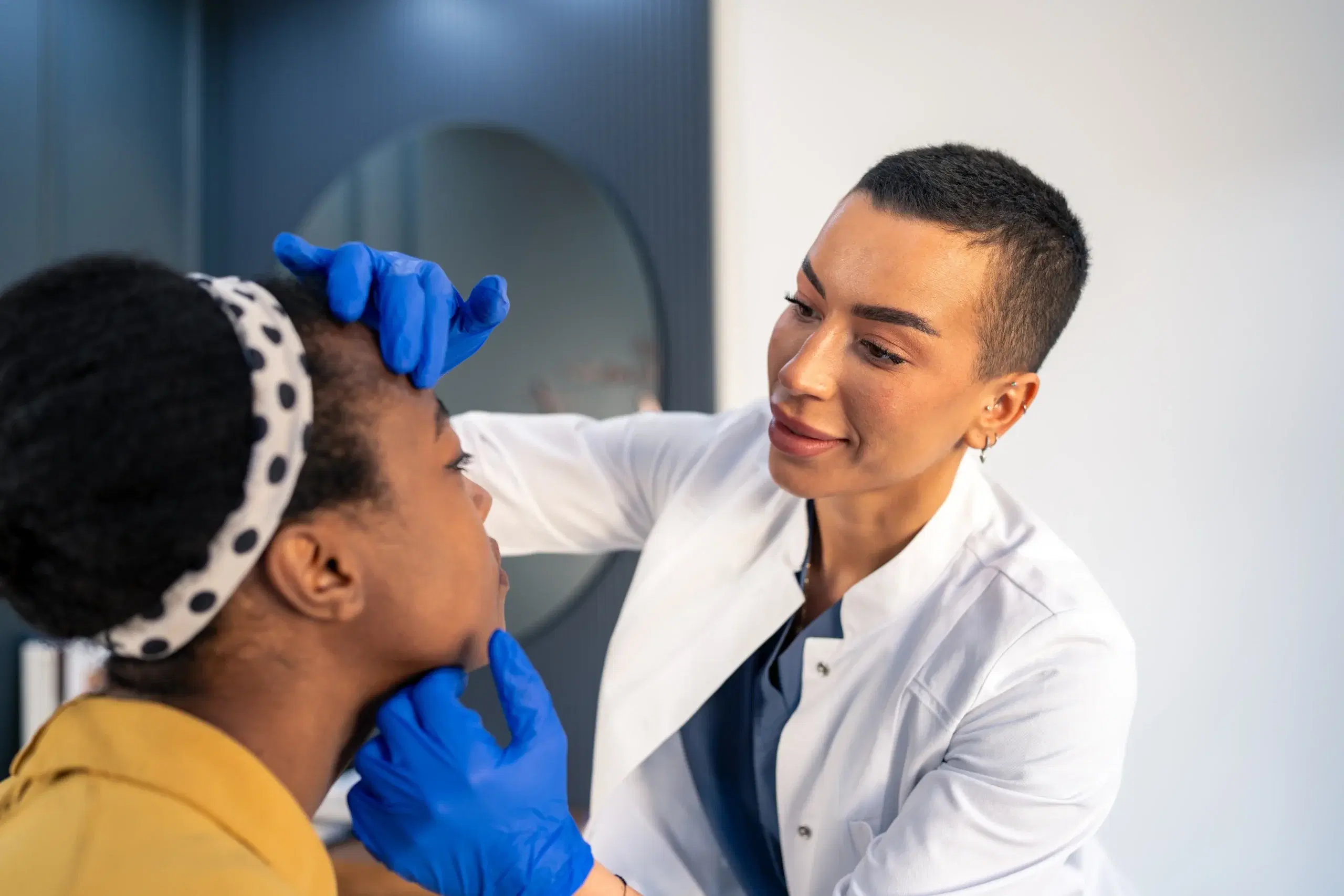 Doctor checking patients skin