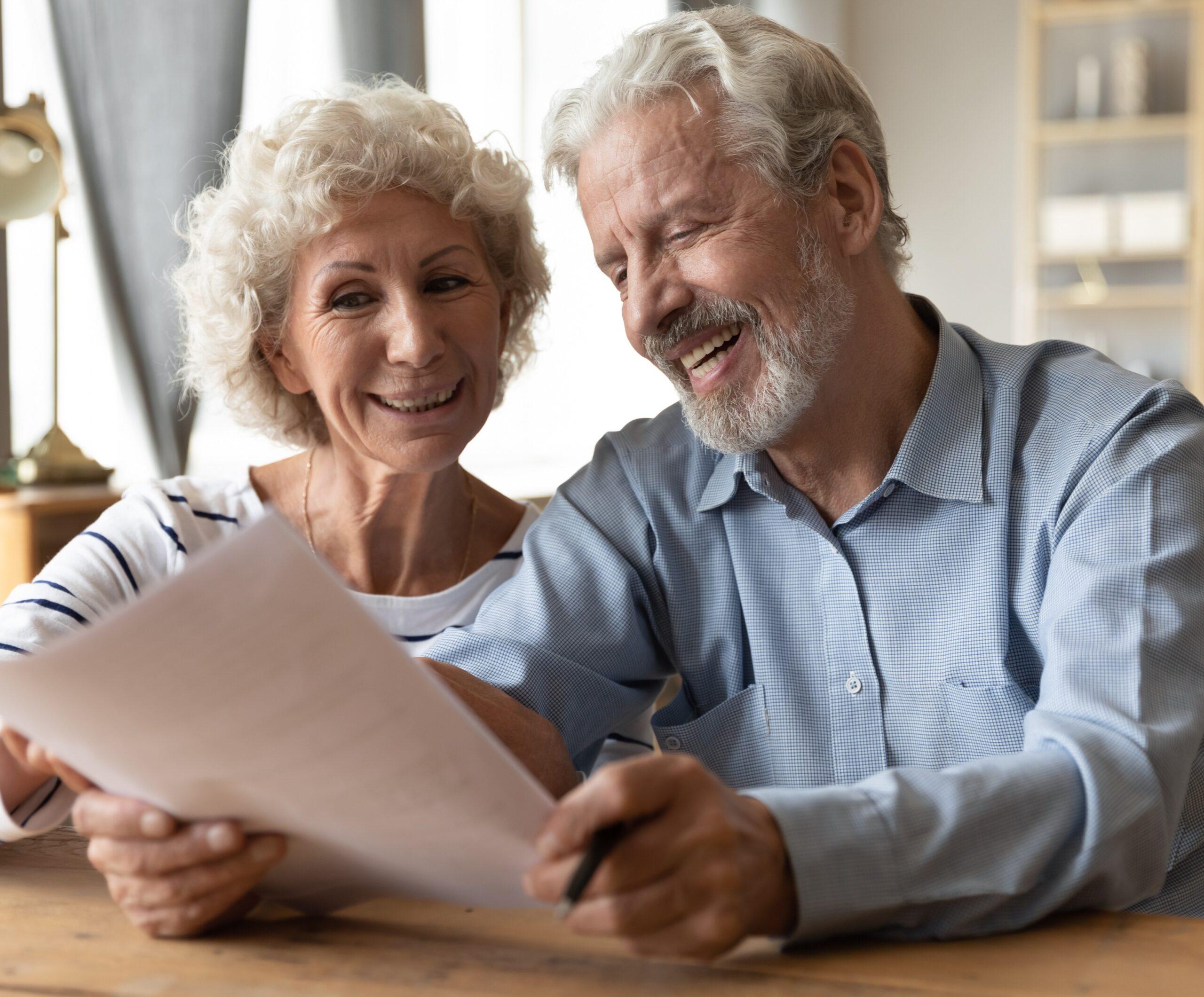 Older adults reviewing Medicare information